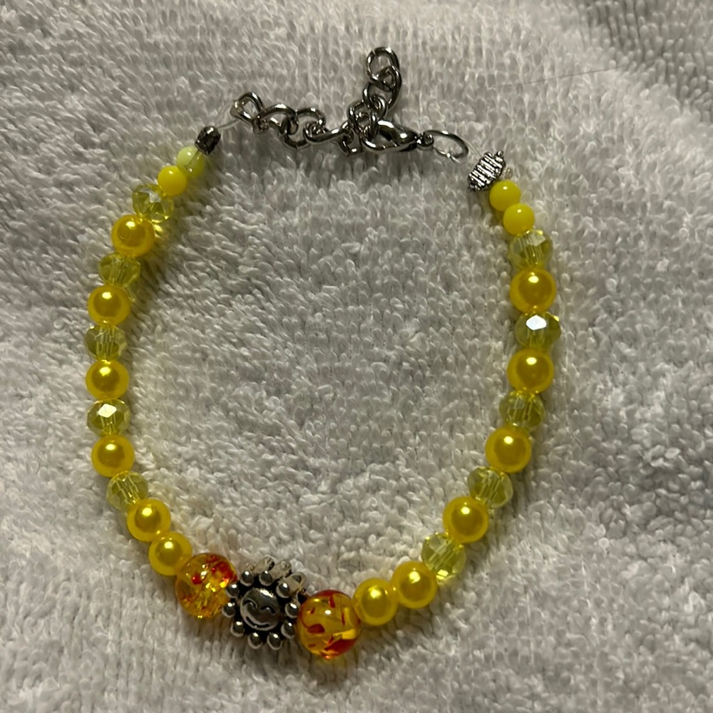 8 inch bracelet with yellow stones with a sunflower charm